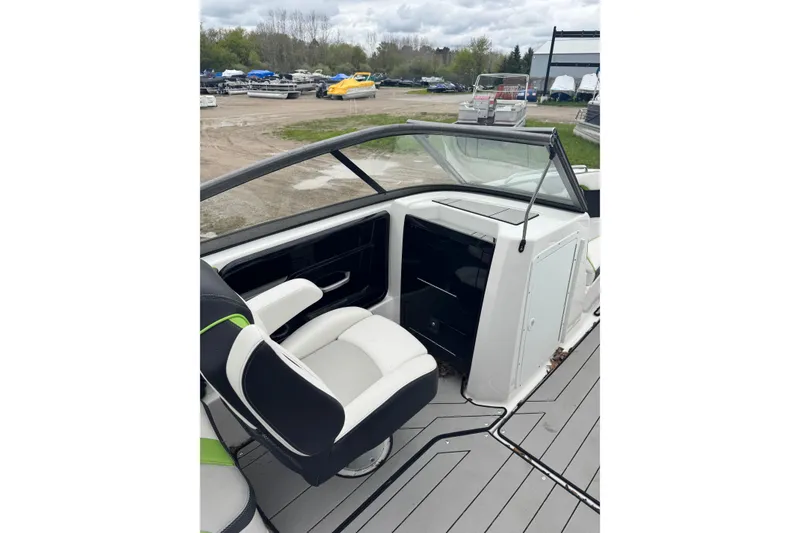 Slide: The Image of 2021 Yamaha Boats 212XD interior with sleek seating and modern dashboard design. - 5
