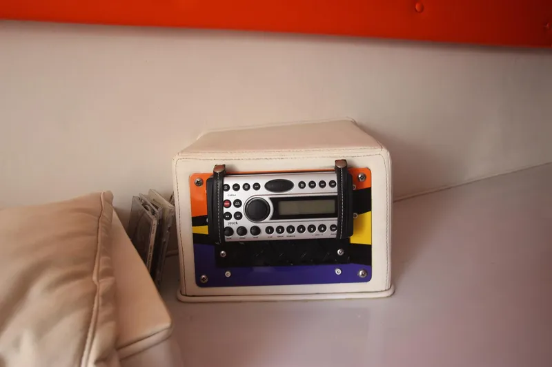 Slide: The Image of Radio system inside a 2001 Cigarette 46 Rough Rider boat, featuring a colorful panel design. - 18