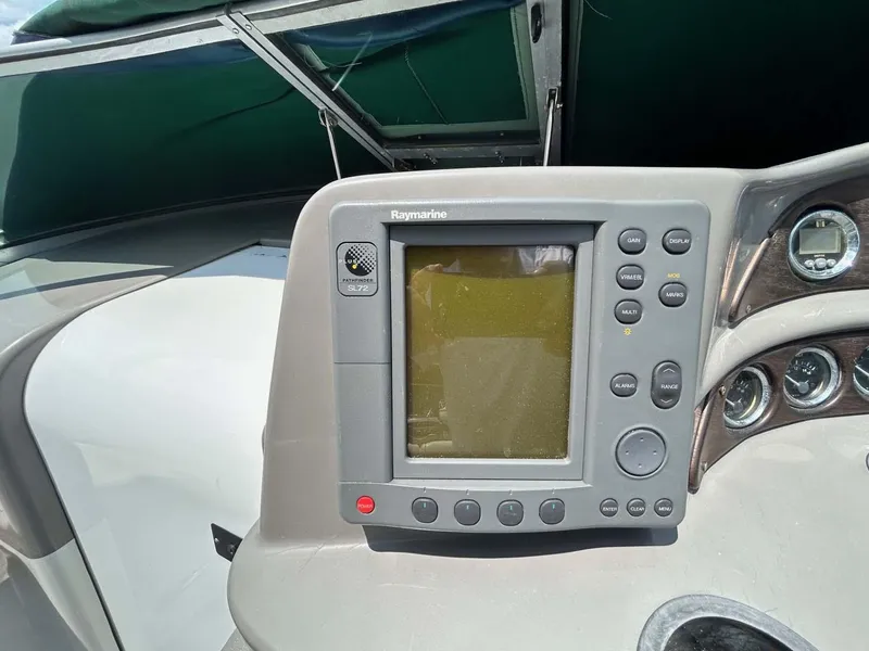 Slide: The Image of Raymarine navigation system on 2001 Four Winns 328 Vista boat dashboard. - 19