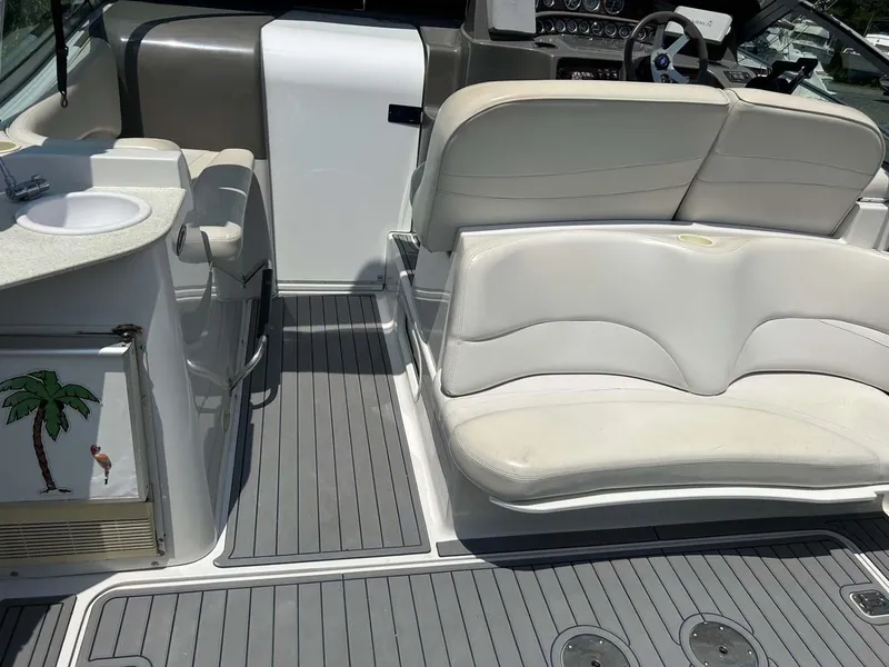 Slide: The Image of 2001 Four Winns 328 Vista boat interior with seating and sink. - 22