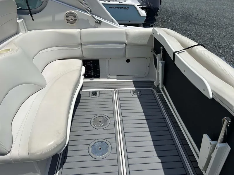 Slide: The Image of 2001 Four Winns 328 Vista boat interior with white seating and gray flooring. - 23