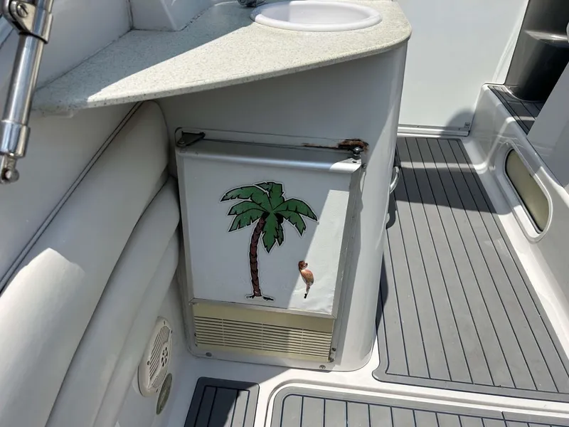 Slide: The Image of 2001 Four Winns 328 Vista boat interior with palm tree decal on cabinet. - 25