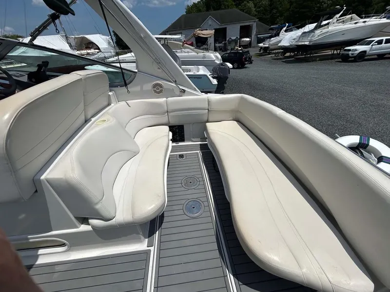 Slide: The Image of 2001 Four Winns 328 Vista boat interior with white seating and gray flooring. - 26