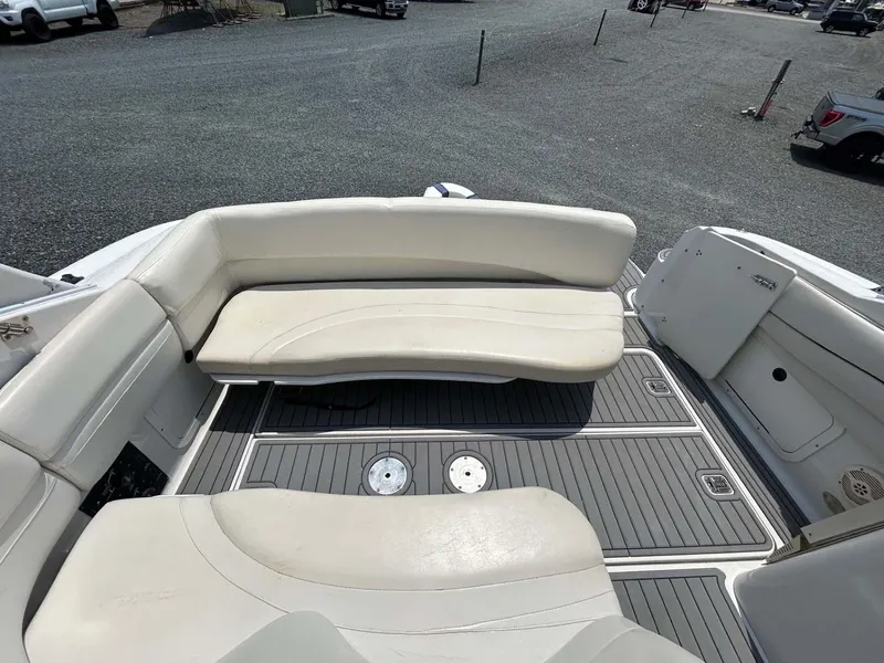 Slide: The Image of 2001 Four Winns 328 Vista boat interior with white seating and gray flooring. - 27