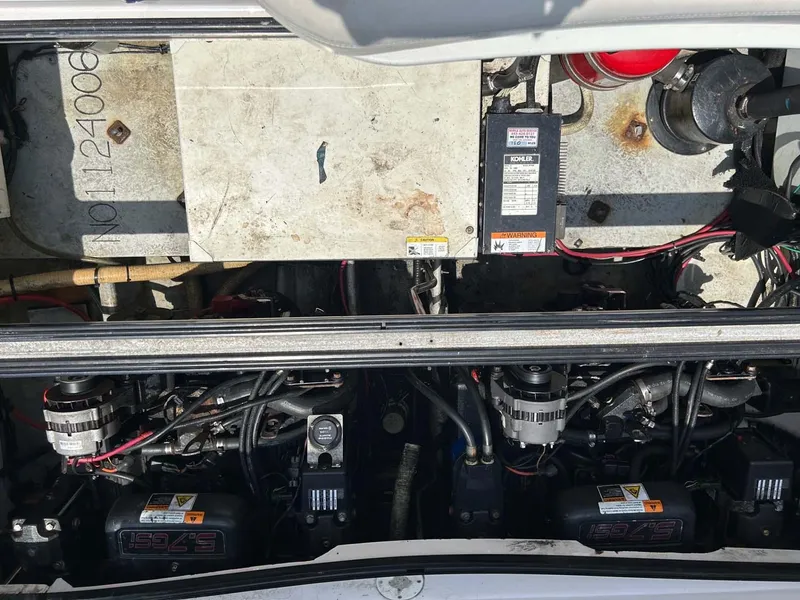 Slide: The Image of Engine compartment of a 2001 Four Winns 328 Vista boat, showing dual engines and wiring. - 28