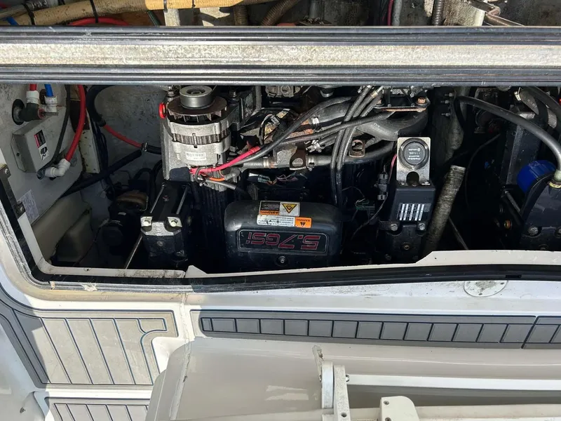 Slide: The Image of Engine compartment of a 2001 Four Winns 328 Vista boat, showing mechanical components. - 29
