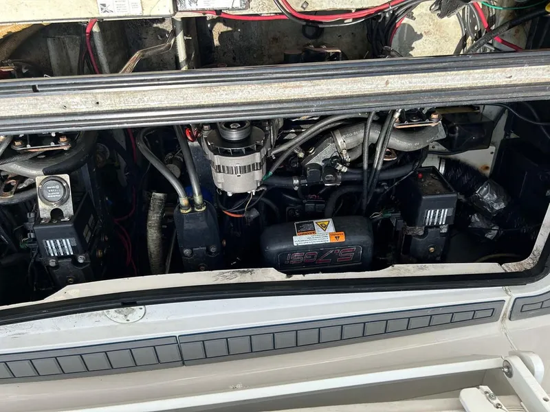 Slide: The Image of Engine compartment of a 2001 Four Winns 328 Vista boat, showing mechanical components. - 30