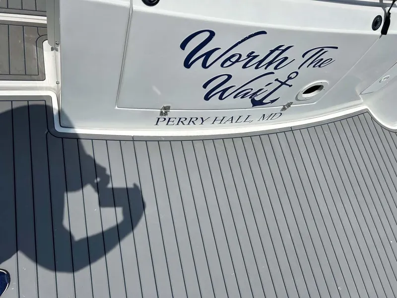 Slide: The Image of 2001 Four Winns 328 Vista boat with "Worth The Wait" and "Perry Hall, MD" text on deck. - 32