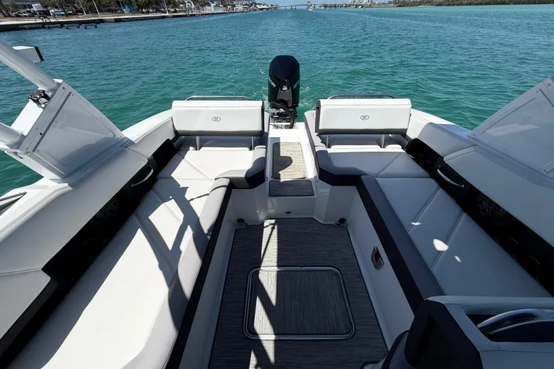 Slide: The Image of 2022 Cobalt R6 Outboard boat interior with spacious seating on clear water. - 11