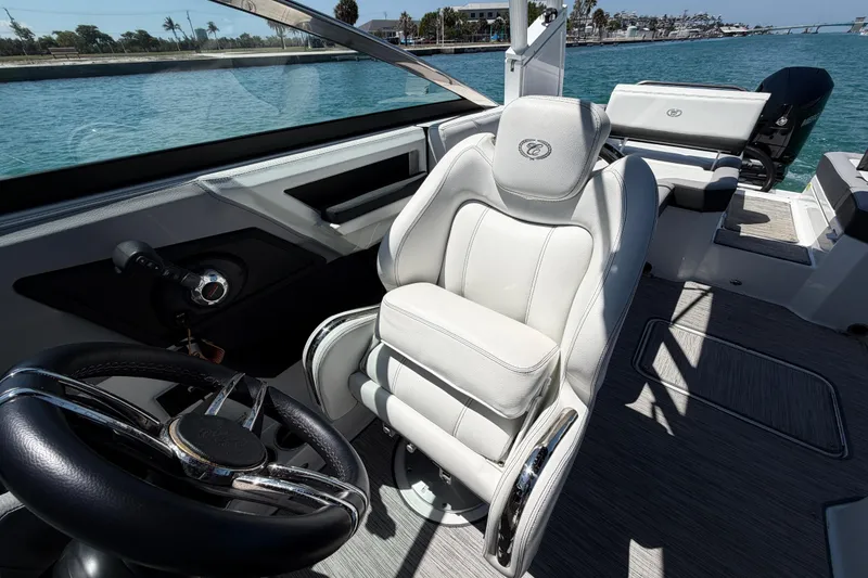 Slide: The Image of Interior of 2022 Cobalt R6 Outboard boat with luxurious seating and steering wheel. - 12
