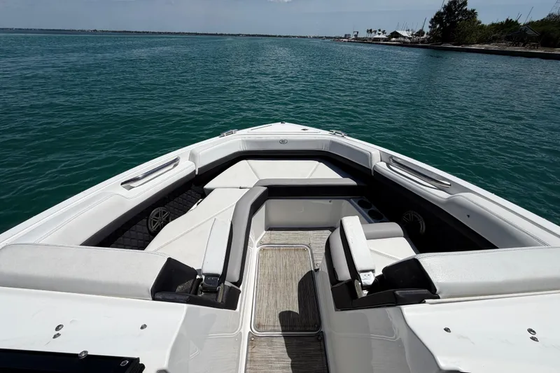 Slide: The Image of 2022 Cobalt R6 Outboard boat interior with spacious seating on calm water. - 15