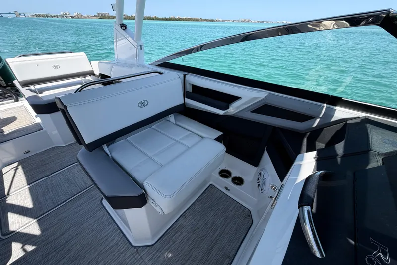 Slide: The Image of 2022 Cobalt R6 Outboard boat interior with luxurious seating and scenic water view. - 9