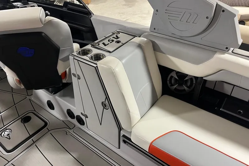 Slide: The Image of 2021 Malibu Wakesetter 25 LSV interior with sleek seating and cup holders. - 12