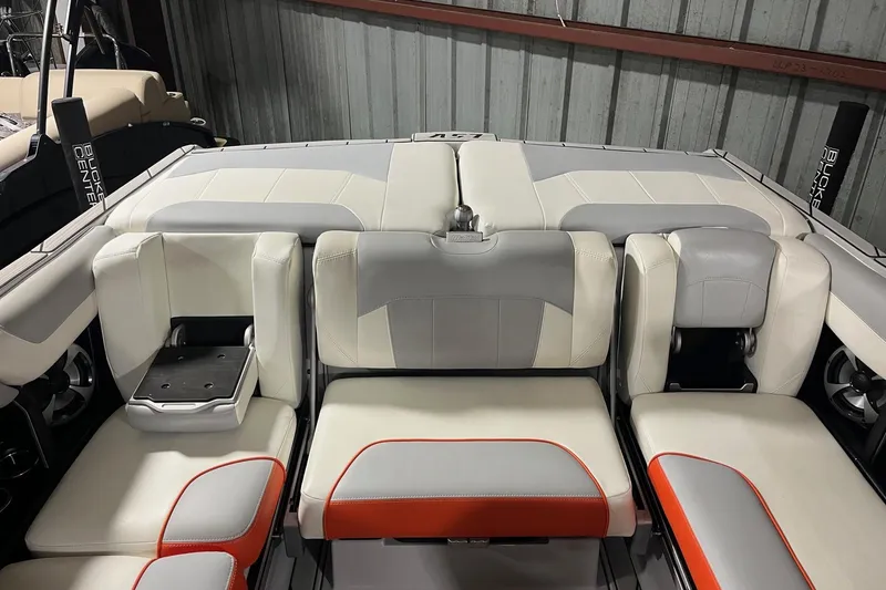 Slide: The Image of 2021 Malibu Wakesetter 25 LSV boat interior with gray and white seating. - 14