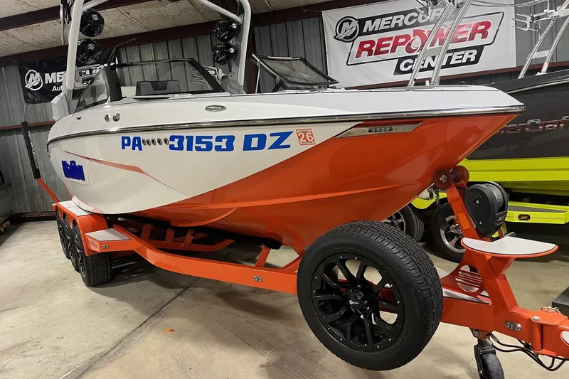 Slide: The Image of 2021 Malibu Wakesetter 25 LSV boat on trailer in showroom setting. - 3