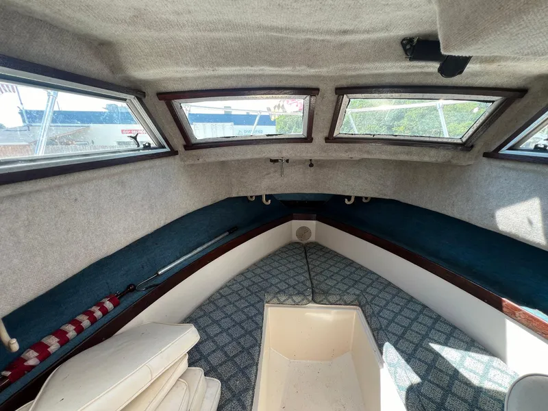Slide: The Image of Interior cabin of 1987 Grady-White Seafarer 226 boat with windows and seating. - 14