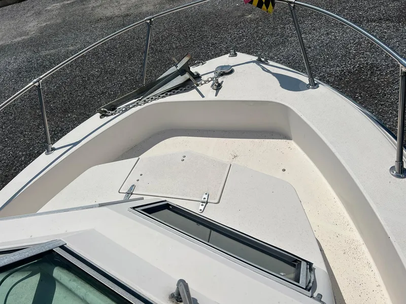 Slide: The Image of 1987 Grady-White Seafarer 226 boat deck with anchor and railing. - 16