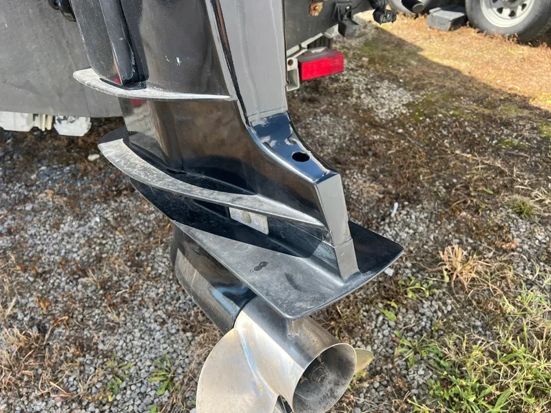 Slide: The Image of Outboard motor of 1987 Grady-White Seafarer 226 on gravel surface. - 19