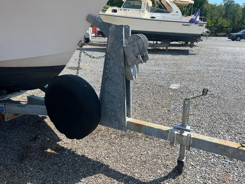 Slide: The Image of 1987 Grady-White Seafarer 226 boat on trailer, parked on gravel lot. - 4