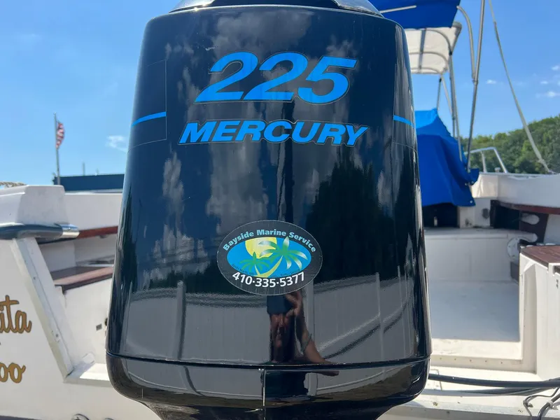 Slide: The Image of Outboard motor on 1987 Grady-White Seafarer 226 boat, featuring Mercury 225 engine. - 5
