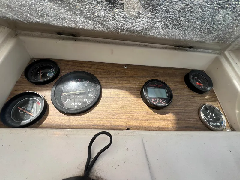 Slide: The Image of Dashboard of 1987 Grady-White Seafarer 226 boat with various gauges and instruments. - 9
