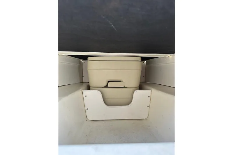 Slide: The Image of Storage compartment with portable toilet in 2002 Arima Sea Ranger 21 Hardtop boat. - 16