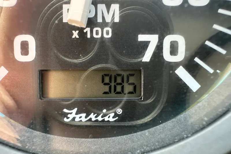 Slide: The Image of Close-up of Faria tachometer displaying 98.5 RPM on Arima Sea Ranger 21 Hardtop. - 5