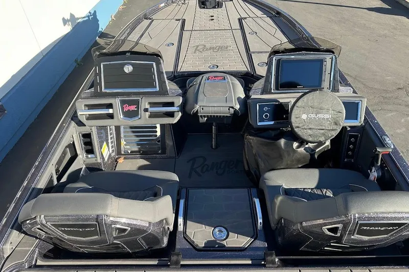 Slide: The Image of 2026 Ranger Z521R Garmin Cup-Equipped boat interior with advanced navigation systems and seating. - 12