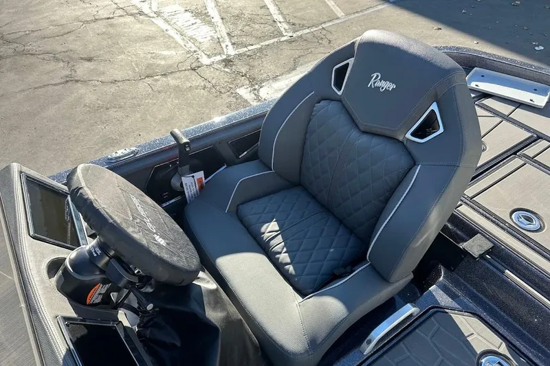 Slide: The Image of 2026 Ranger Z521R Garmin Cup-Equipped boat seat with quilted design and steering wheel cover. - 13