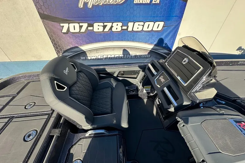 Slide: The Image of 2026 Ranger Z521R Garmin Cup-Equipped boat interior with sleek black seating and advanced dashboard. - 16