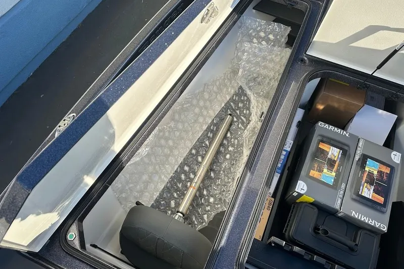 Slide: The Image of 2026 Ranger Z521R boat storage with Garmin equipment and bubble wrap packaging. - 27