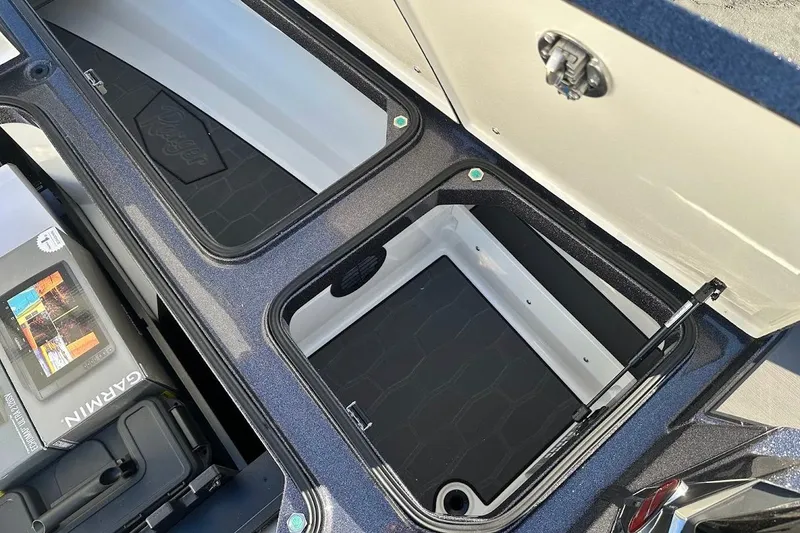 Slide: The Image of Open storage compartments in a 2026 Ranger Z521R Garmin Cup-Equipped boat. - 29