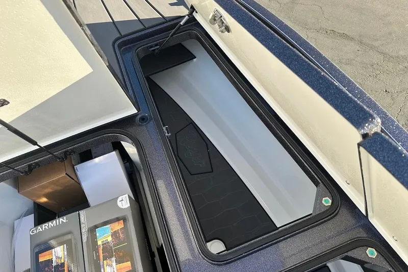 Slide: The Image of 2026 Ranger Z521R Garmin Cup-Equipped boat storage compartment with Garmin electronics boxes. - 30