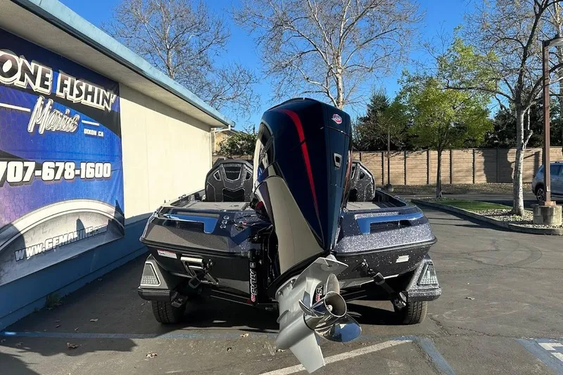 Slide: The Image of 2026 Ranger Z521R Garmin Cup-Equipped boat parked outside a marine shop. - 8