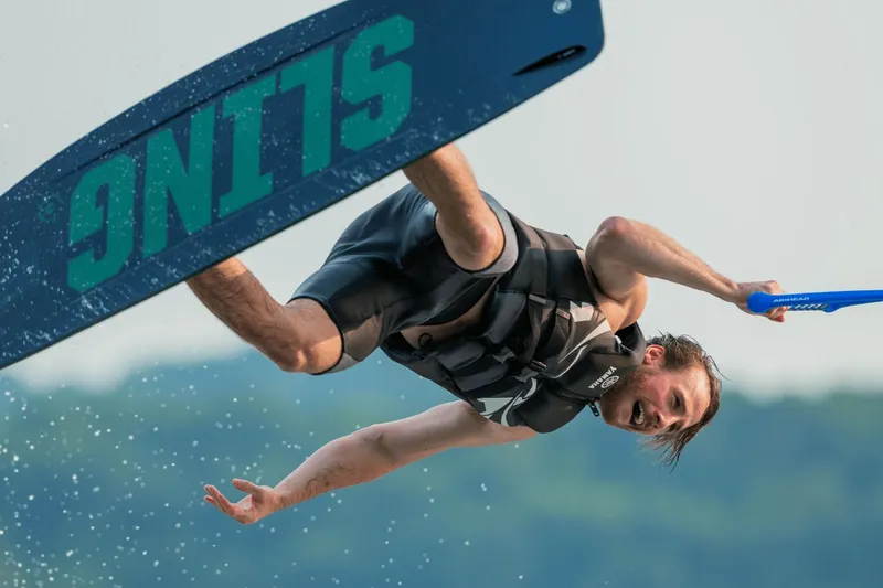 Slide: The Image of Man wakeboarding with Yamaha AR220 boat, 2026 model. - 11