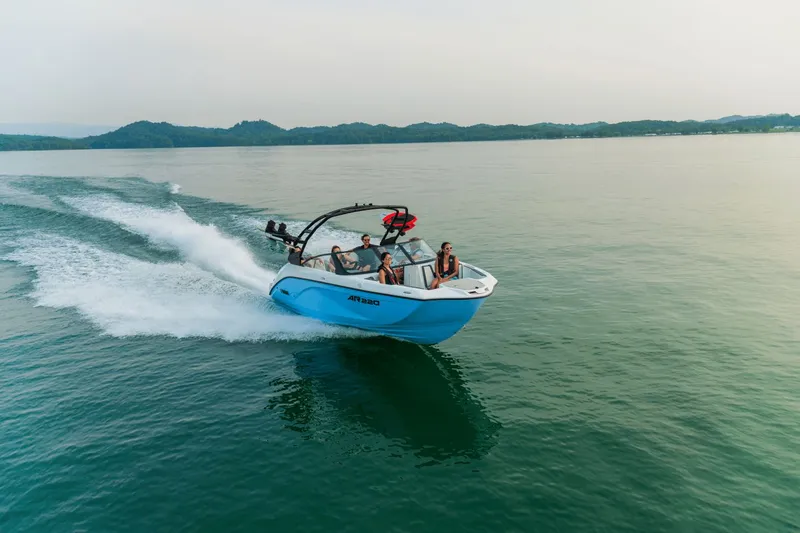Slide: The Image of Yamaha AR220 2026 boat cruising on calm water with passengers. - 19