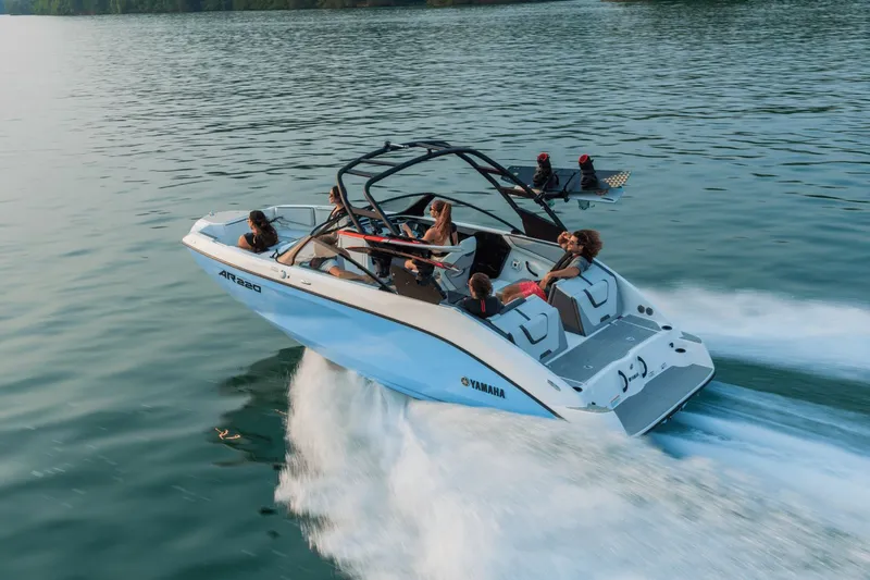 Slide: The Image of Yamaha AR220 2026 boat on water with passengers. - 2