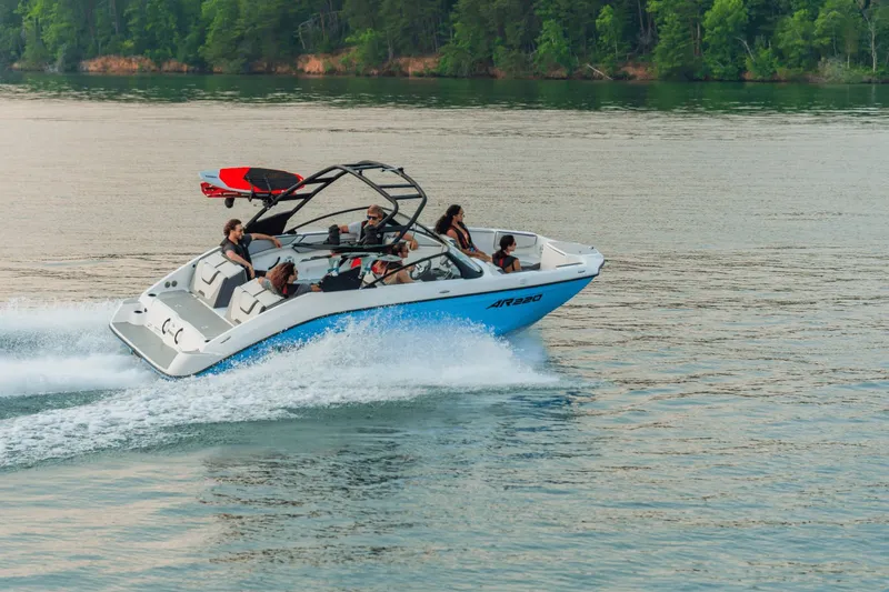 Slide: The Image of Yamaha AR220 2026 boat cruising on a lake with passengers. - 20
