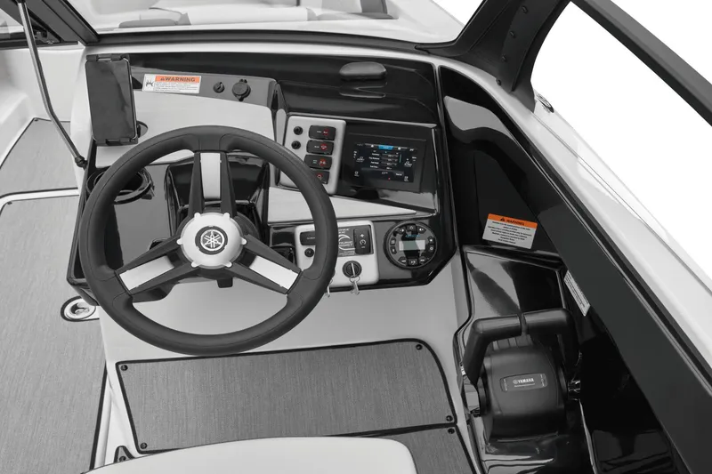 Slide: The Image of Yamaha Boats AR220 2026 helm with steering wheel and controls. - 35