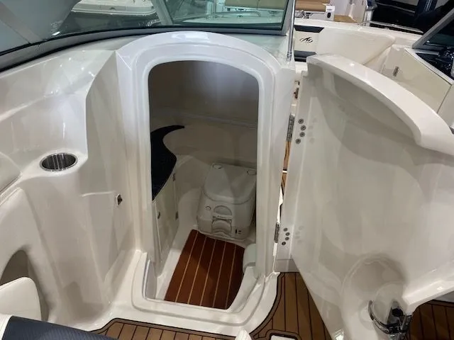 Slide: The Image of Interior of a 2012 Monterey 264FS with toilet and wooden flooring. - 13