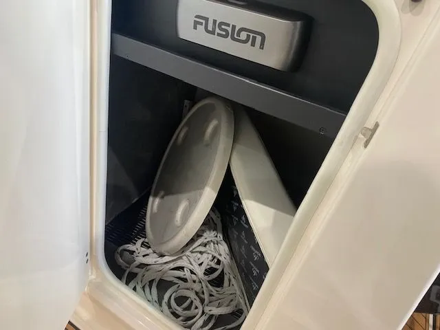 Slide: The Image of Storage compartment in Monterey 264FS boat with Fusion speaker. - 16
