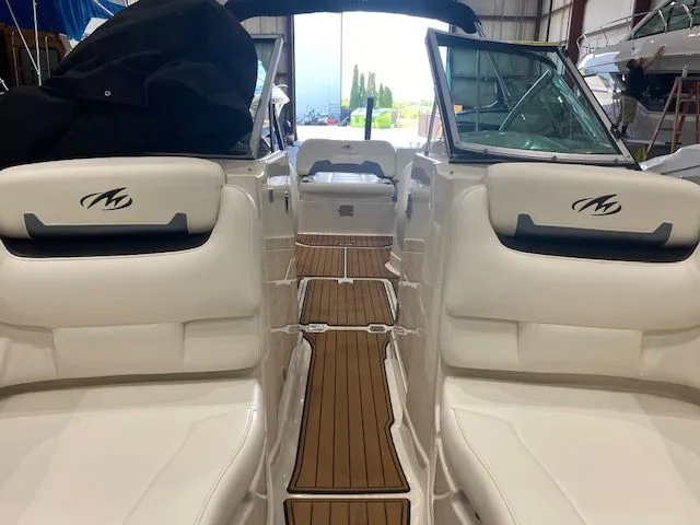 Slide: The Image of Interior of a 2012 Monterey 264FS boat with white seating. - 18