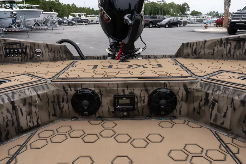 Slide: The Image of Interior view of 2026 Excel 183 Tomahawk boat with hexagonal pattern flooring. - 13