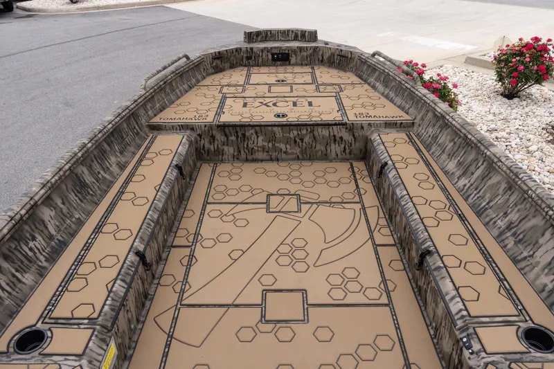 Slide: The Image of 2026 Excel 183 Tomahawk boat interior with camouflage design and geometric patterns. - 6