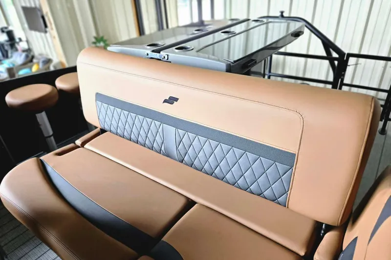 Slide: The Image of Luxurious seating in the 2026 Starcraft SLS 3 DL DH BAR boat, featuring elegant diamond stitching. - 11