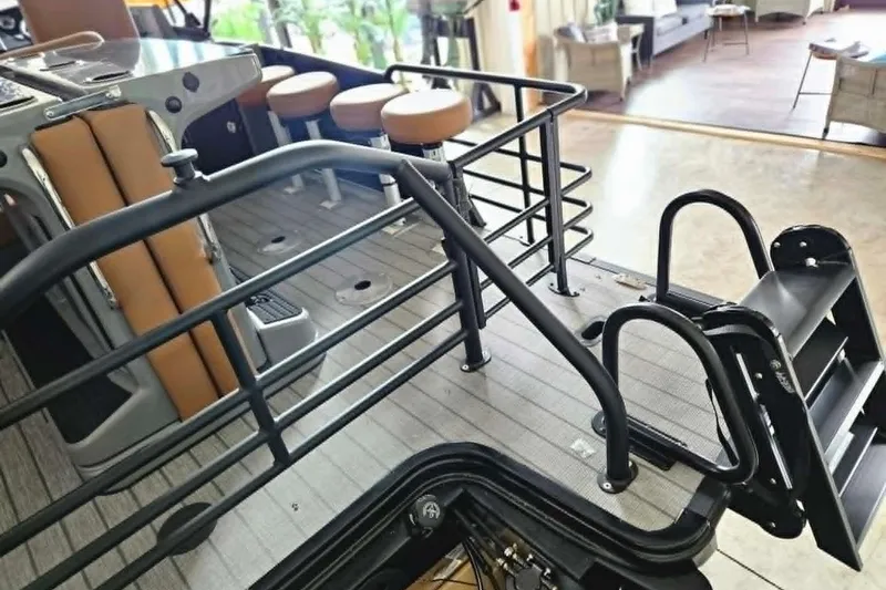 Slide: The Image of 2026 Starcraft SLS 3 DL DH BAR boat interior with seating and railing. - 14