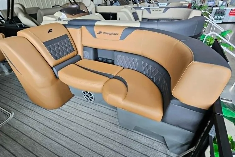Slide: The Image of Luxurious seating on 2026 Starcraft SLS 3 DL DH BAR boat, featuring tan and gray upholstery. - 3