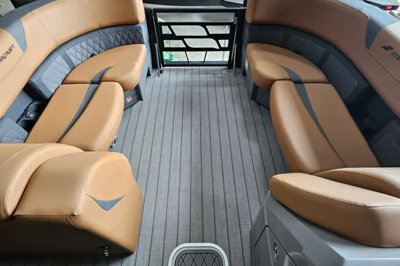 Slide: The Image of Luxurious interior of 2026 Starcraft SLS 3 DL DH BAR boat with tan seating. - 4