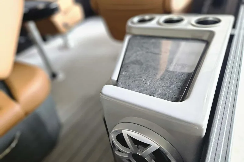 Slide: The Image of Interior detail of 2026 Starcraft SLS 3 DL DH BAR, featuring modern cup holders and speaker. - 9