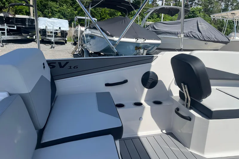 Slide: The Image of 2026 Starcraft SV 16 OB boat interior with seating and cup holders. - 10